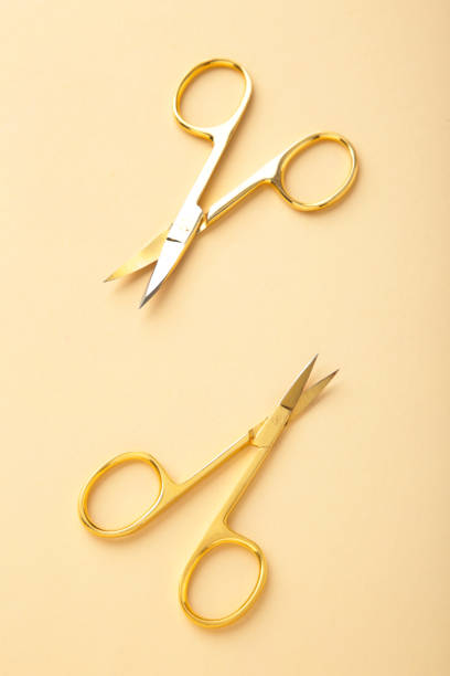 istock Scissors for manicure woman nails on beige background with copy space 1320017065