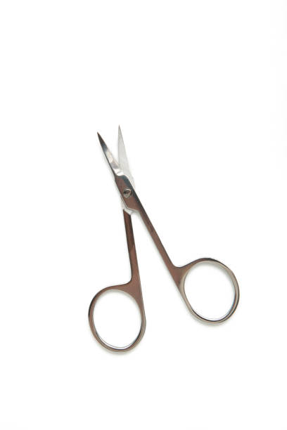 istock Small metal manicure scissors isolated on white background 1320017157