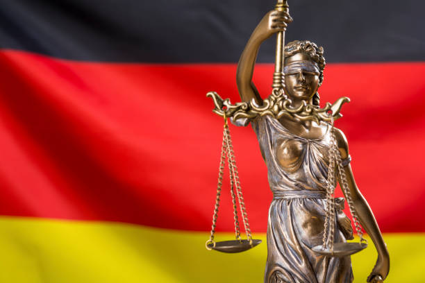 istock Lady justice against German flag 1320020450