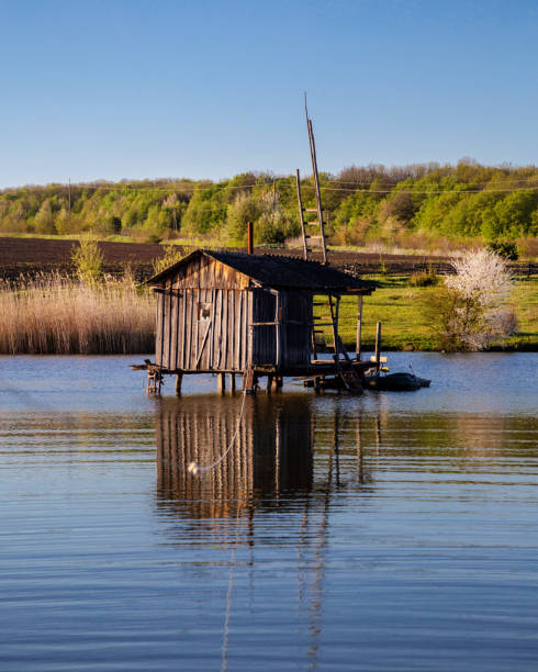 istock Fisherman's house on the water on a spring day. 1320025237