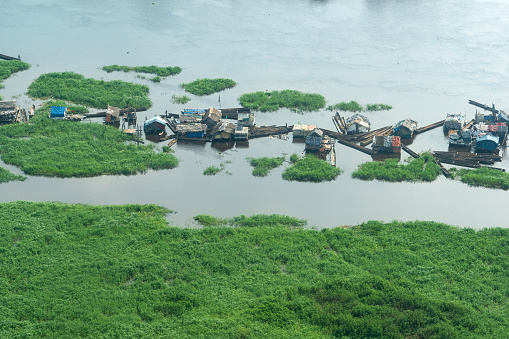 Kinshasa, Democratic Republic of Congo - December 13, 2014:\nAerial view of a floating village on the Congo River in an outlying district of Kinshasa, the capital of DR Congo.