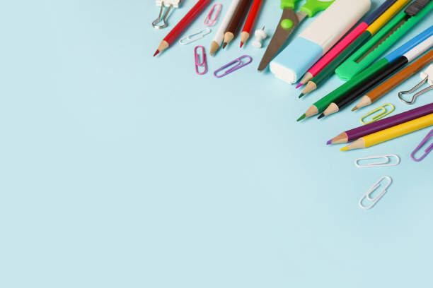 istock School and office supplies on blue background, back to school 1320026699