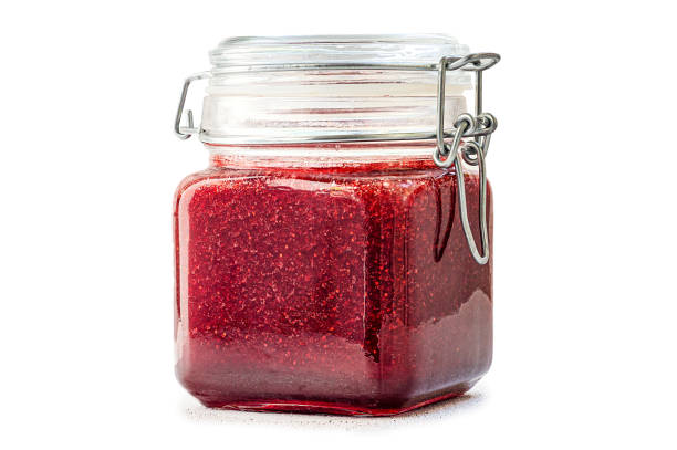 istock Strawberry jam glass jar isolated on white background 1320030292