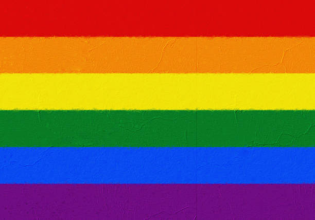 istock LGBT flag painted with paint on a concrete wall 1320031511
