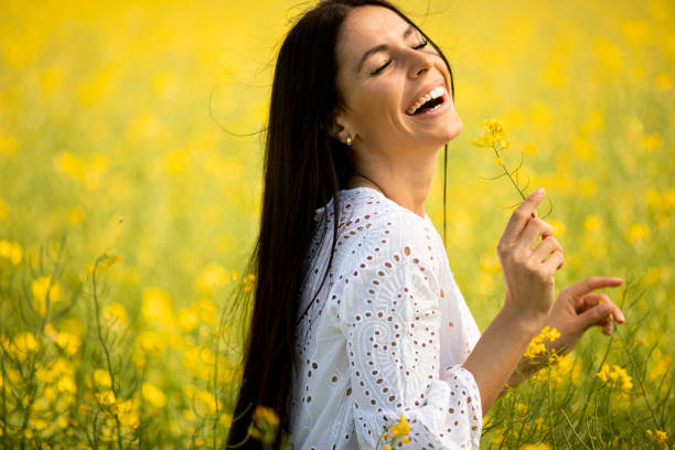 istock Young woman in the rapeseed field 1320035135