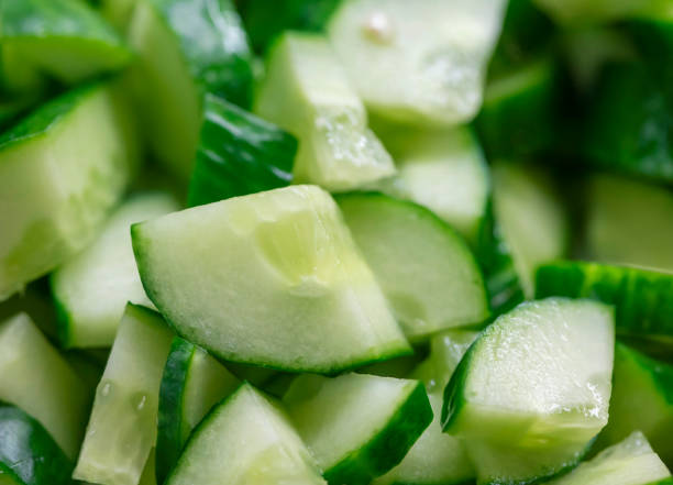 istock Juicy sliced pieces of cucumber 1320036295