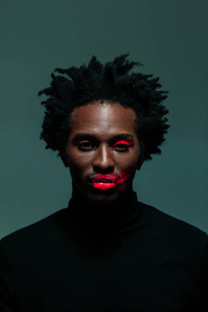 istock Man with make-up on eye and lips 1320037309