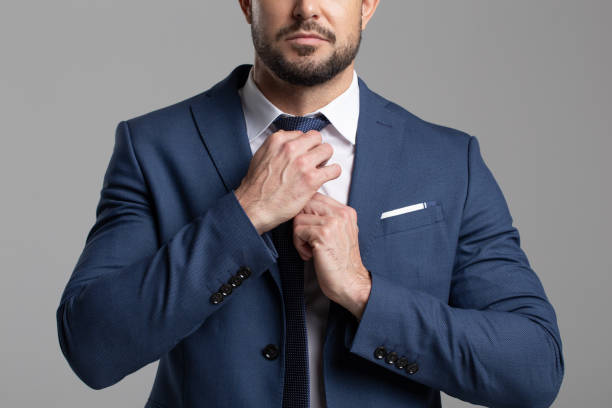 istock Confident professional businessman adjusting the tie 1320037384