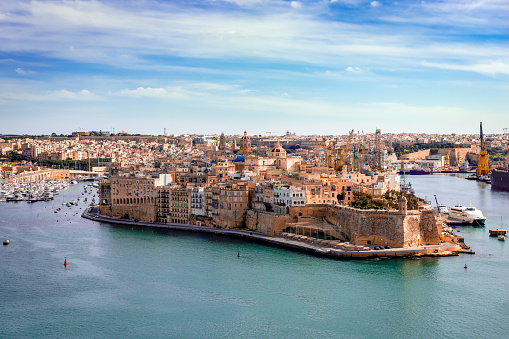 Valletta, Malta: View from Upper Barrakka Gardens. Birgu or Vittoriosa (one of the Three Cities at the Grand Harbour) dominates the picture. St Angelo fort is on the waterfront