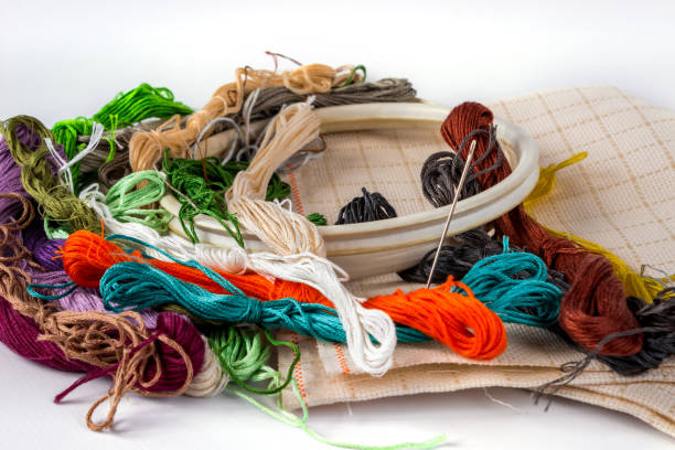 istock Accessories for embroidery: hoop, moulin, canvas and needle. The concept of needlework. 1320038321