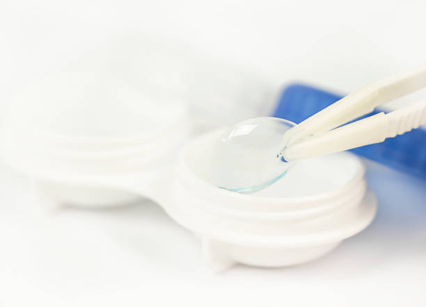 istock A container with lenses for vision and tweezers close-up. 1320038612