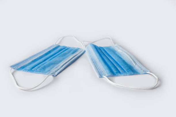 istock Medical masks are isolated against a white background. 1320038904