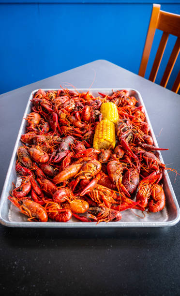 istock Boiled Crawfish with Yellow Corn on the Cob 1320040201