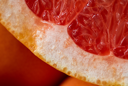 Closeup of delicious grapefruit. Macro photoghraphy with fruit texture.