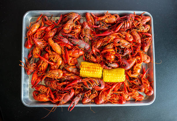 istock Boiled Crawfish with Yellow Corn on the Cob 1320040212