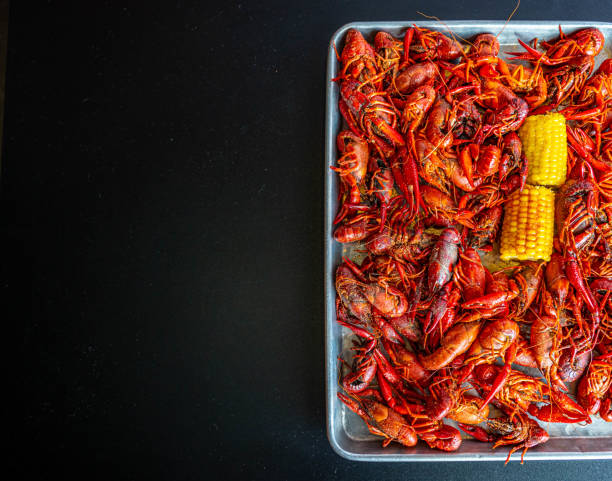 istock Boiled Crawfish with Yellow Corn on the Cob 1320040219