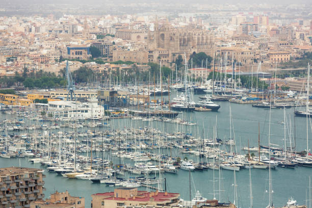 Panoramic aerial view of Palma de Mallorca. The capital of the popular resort island. Yachts in the bay with blue water. Gothic architecture of Europe. Spain Attractions