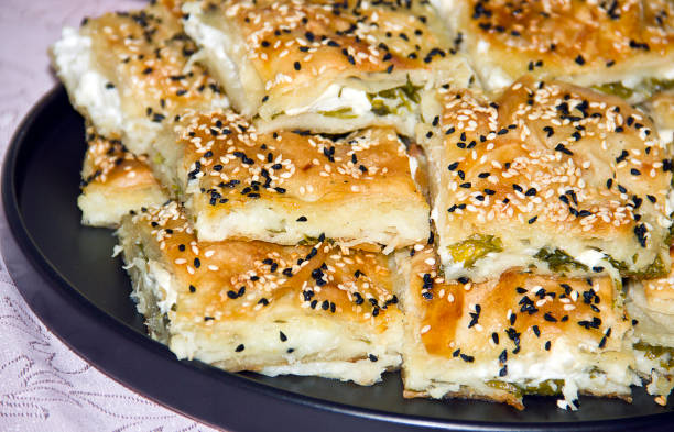 Cheese pastry börek Turkish börek stuffed with sesame parsley and cheese filo pastry stock pictures, royalty-free photos & images