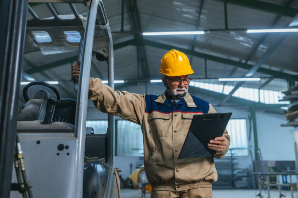 istock Man with helmet working in industrial factory or warehouse 1320041250