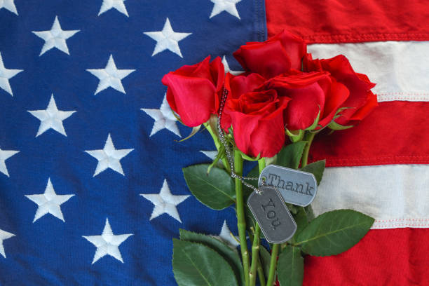istock American flag with roses and military dog tags 1320042388