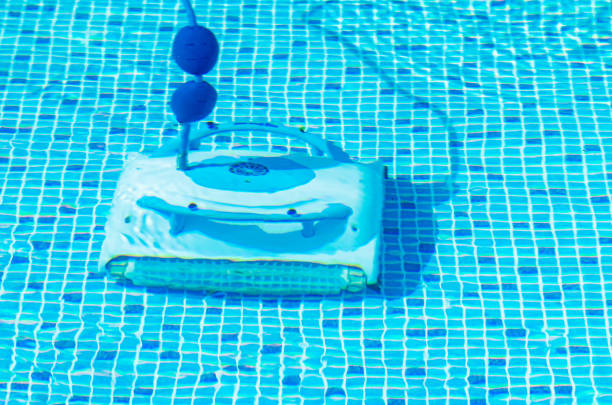 istock Cleaning the pool bottom with an underwater vacuum cleaner 1320042397