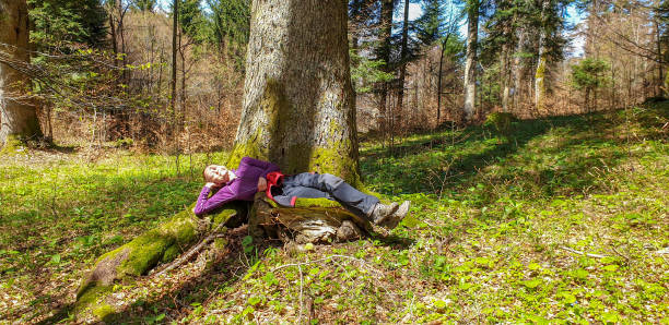 istock Mature women relaxing in forest 1320042435