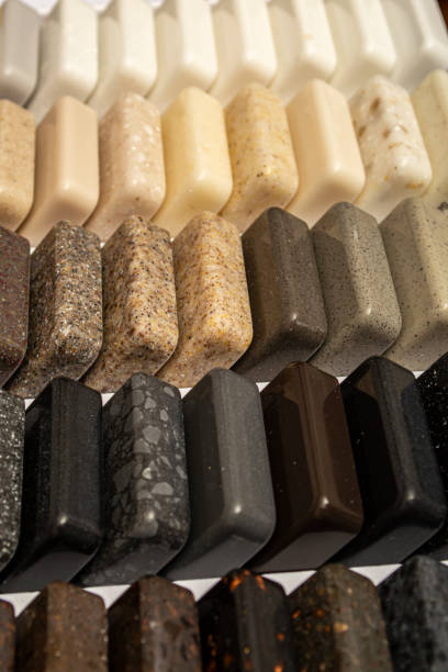 istock Samples of natural granite, marble and quartz stone, countertops. Model from stones, close-up. Modern colored slabs made of natural stone. 1320042485