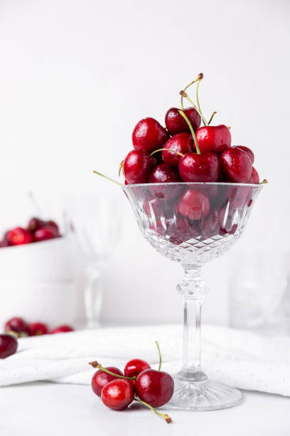 istock Fresh beautiful cherries in a cut crystal glass 1320043277