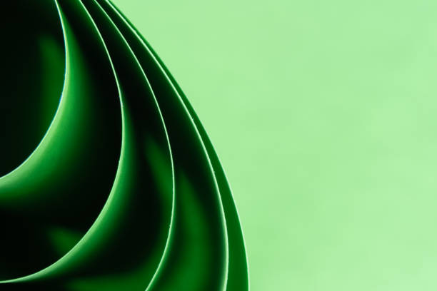 istock Abstract green colored background with curved lines and shapes 1320044219