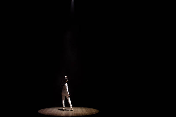 istock Woman model on stage demonstrates a trouser white suit 1320049709
