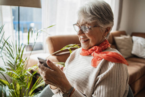 istock Senior woman at home, relaxing and using smart phone 1320051954