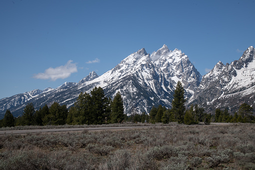 View of the Teton mountain range as seen approaching the Grand Teton National Park from the east. Near towns are Dubois, .Moran and Jackson Hole, Wyoming in western USA