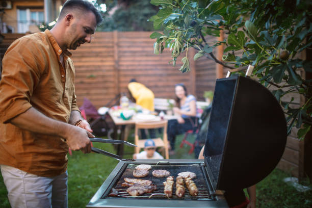 istock Man grilling meat for the barbecue party 1320054639