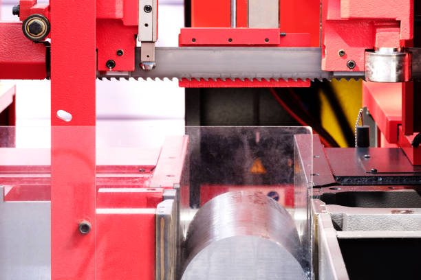 istock Automatic bandsaw sawing metal workpiece, industrial concept background 1320054778