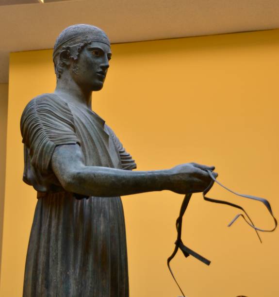 statue of the Italian poet Giosue Carducci (1835-1907) on Piazzetta di Giosuè Carducci in front of the entrance to the Nicola Bernardini Library in the city of Lecce; Lecce, Italy