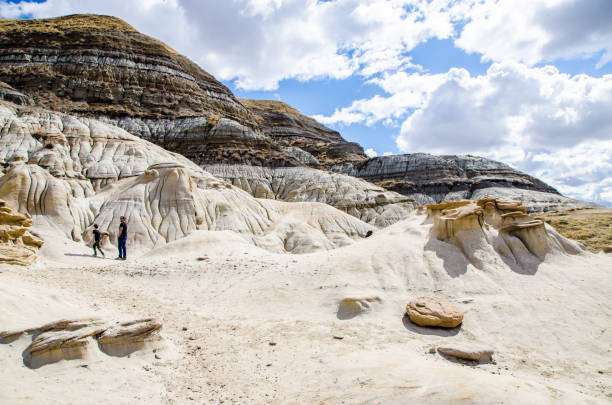 People walking in Hoodoos trail , Drumheller, Alberta, during day of springtime