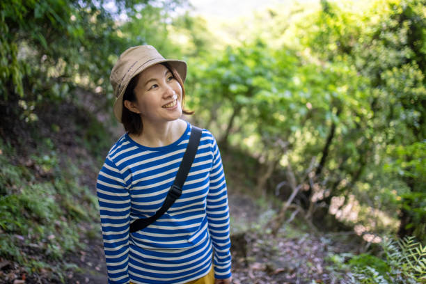 Young woman hiking, looking at view