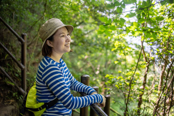 istock Young woman hiking, looking at view 1320065455