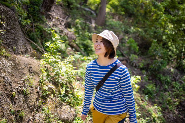 istock Young woman climbing moutain 1320065994