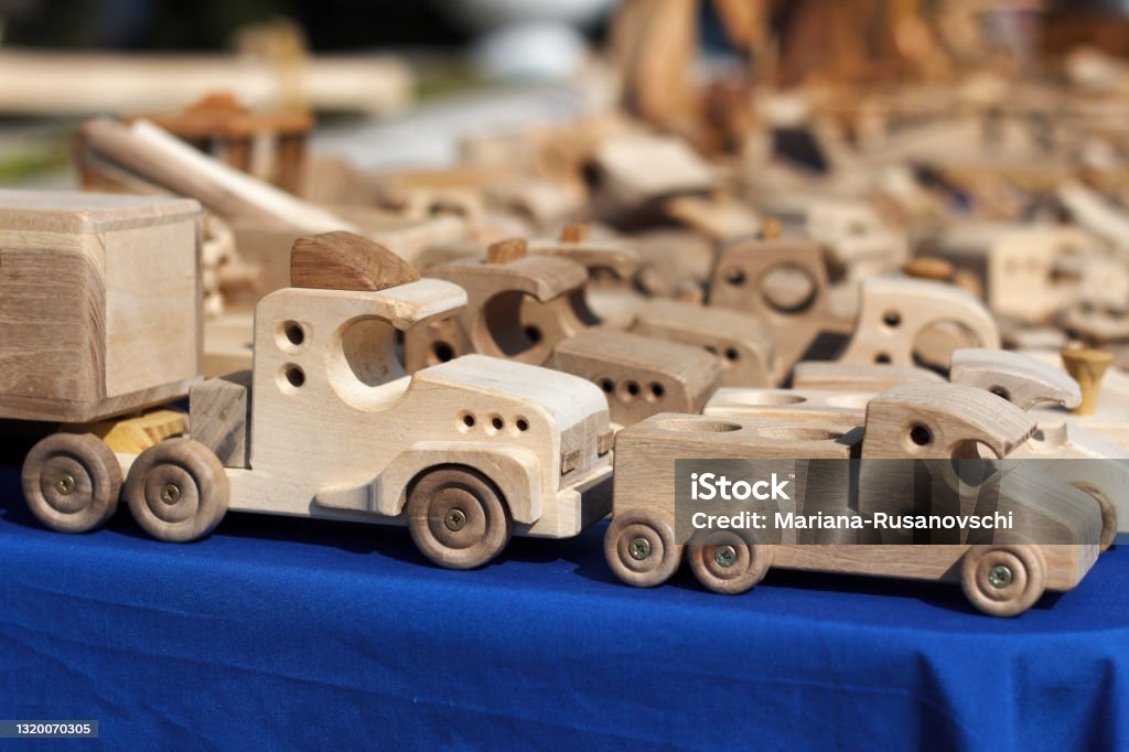 Wood carving, exhibition of professionally carved cars, trucks for children Wood carving, exhibition of professionally carved cars, trucks for children, toys Art Stock Photo