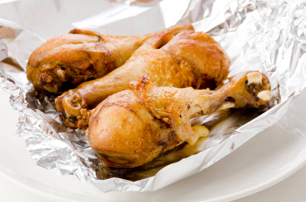 istock Grill Chicken Legs on Aluminum Foil 1320072381
