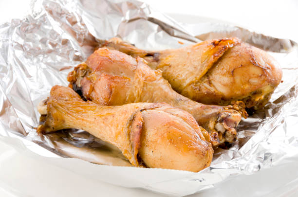 istock Grill Chicken Legs on Aluminum Foil 1320073211