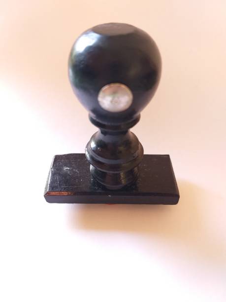 istock Black wooden stamp handle on white background 1320074008