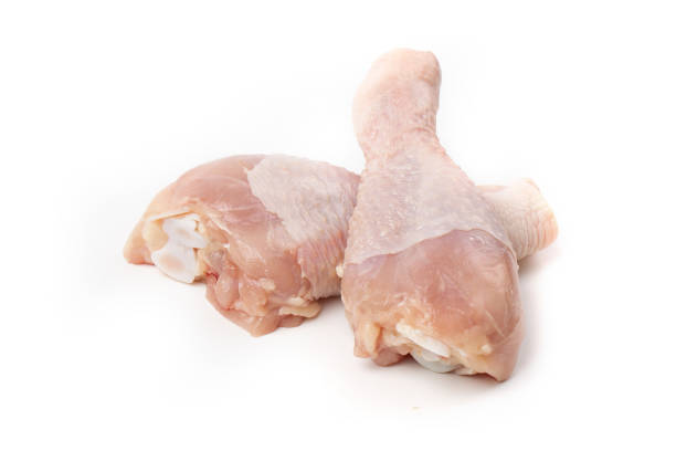 istock Raw chicken drumsticks, isolated on white background. 1320077394