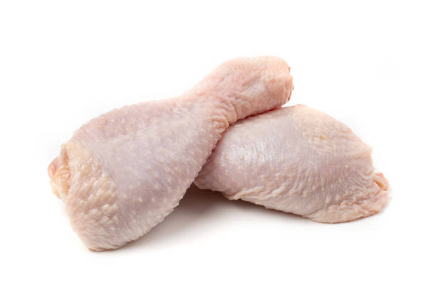 istock Raw chicken drumsticks, isolated on white background. 1320077398
