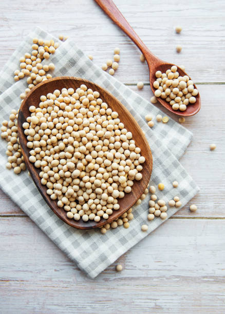 istock Soybeans on a wooden plate 1320085646