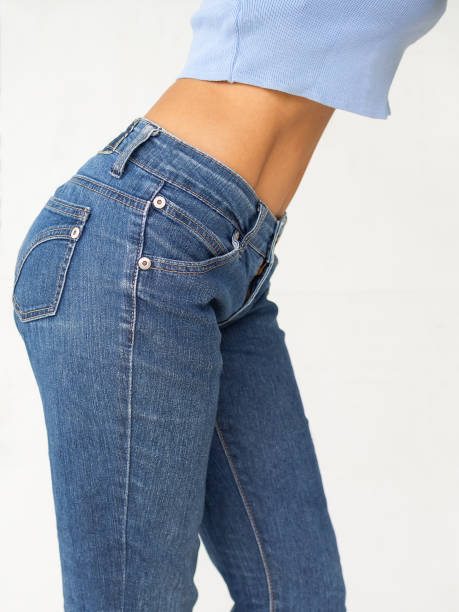 istock Slim woman with jeans on white background. 1320085663