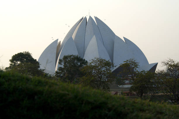 istock Lotus Temple behind Greenery, Delhi 1320087652