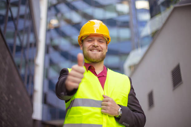 istock Smiling engineer standing on the street. Cloe up. Thumb up. 1320089670