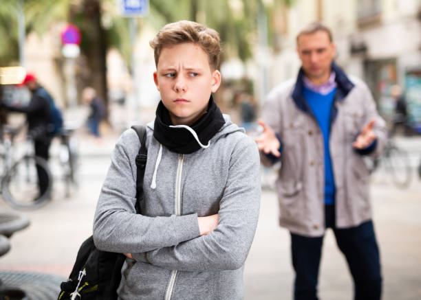 istock Upset teenage boy scolded by father 1320092021
